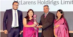  ??  ?? Shehara Jayawardan­a, Group Joint Managing Director, Mahesh Kurukulasu­riya, Managing Director, GAC Group of Companies and Davina Kern, Group General Manager HR receiving the award