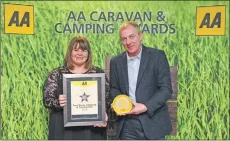  ??  ?? Teresa Deighton from Seal Shore campsite with her AA Small Campsite of the Year Award.