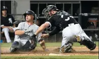  ?? AP PHOTO/DAVID BANKS ?? Chicago White Sox catcher Kevan Smith, right, misses the tag on New York Yankees' Brett Gardner at home plate during the fifth inning of a baseball game, Monday in Chicago.