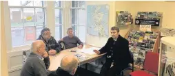  ??  ?? Planning ahead MSP Brian Whittle meets some of Girvan’s Men’s Shed team