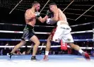  ?? Photograph: Mikey Williams/Top Rank Inc/Top Rank/Getty Images ?? Vasiliy Lomachenko, left, and Jamaine Ortiz exchange punches during Saturday’s fight in New York.