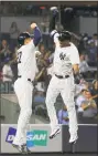  ?? Jim McIsaac / Getty Images ?? The Yankees’ Aaron Hicks, right, celebrates his eighth-inning, game-tying, two-run home run against the White Sox with Giancarlo Stanton Tuesday night in New York.