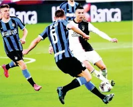  ?? FILE ?? Inter Milan’s Stefan de Vrij (left) and Juventus’ Cristiano Ronaldo battle for the ball during a Serie A match at the Allianz Stadium in Turin, Italy, on Sunday, March 8.