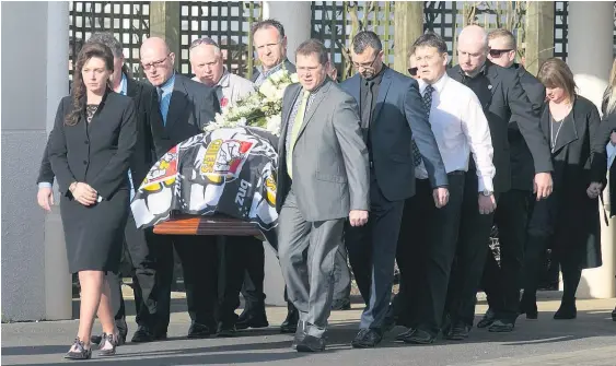  ?? Picture / Mark Mitchell ?? Craig Norgate's coffin is carried to the hearse after his funeral service in Hawera.