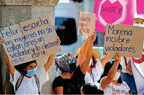  ?? Associated Press ?? Women protest against Felix Salgado during a visit by Mexican President Andres Manuel Lopez Obrador and Argentina’s President Alberto Fernandez in Iguala, Mexico on Wednesday.