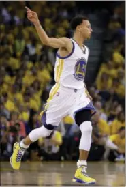  ?? BEN MARGOT — THE ASSOCIATED PRESS ?? Golden State Warriors guard Stephen Curry scored 26 points in his team’s 108-100 overtime win over the Cleveland Cavaliers on Thursday.