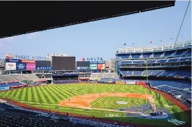  ?? FRANK FRANKLIN II/ASSOCIATED PRESS ?? Boston Red Sox players take batting practice Thursday at Yankee Stadium, but that was about it for baseball action after certain Yankees tested positive for COVID-19.