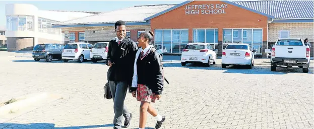  ?? Pictures: JUDY DE VEGA ?? GOOD FEELING: Two of Jeffreys Bay Comprehens­ive High School’s first group of matric pupils, proudly leave school after writing exams