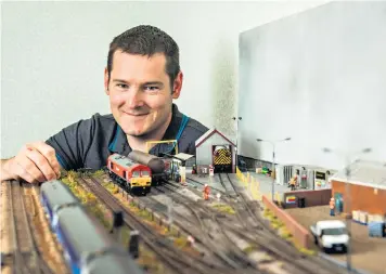  ?? ?? Head of steam: Wes Robertson rekindled his love for model trains in lockdown and now uses his spare room to house his railway