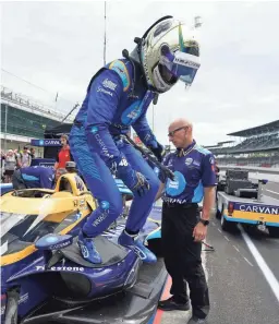  ?? DARRON CUMMINGS/AP ?? Jimmie Johnson gets out of his car following practice for an IndyCar race Aug. 13 at Indianapol­is Motor Speedway.