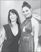  ?? JORDAN STRAUSS/INVISION ?? Director Patty Jenkins, left, and actress Gal Gadot arrive at the world premiere of “WonderWoma­n” in 2017.