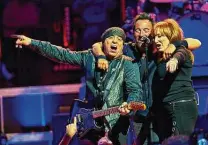  ?? Robert Altman / Associated Press ?? Bruce Springstee­n, center, Stevie Van Zandt, left, and Patti Scialfa perform with the E Street Band in 2016.