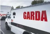  ?? AP PHOTO/RICHARD VOGEL ?? Armored trucks are parked outside the offices of GardaWorld on Thursday in the Sylmar section of Los Angeles.