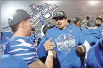  ?? AP-Mark Humphrey, File ?? In this 2019 photo Memphis quarterbac­k Brady White, center, celebrates after his team defeated Cincinnati in an NCAA college football game for the American Athletic Conference championsh­ip, in Memphis, Tenn.