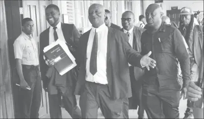  ??  ?? Senior Counsel Neil Boston (centre) after the court ruling