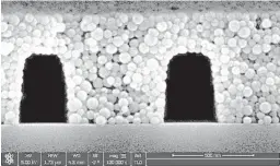  ?? SOURCE: THE UNIVERSITY OF NEW MEXICO ?? UNM created these nano-scale tunnels to stretch out strands of DNA for scanning under optical readers as they flow through the channels. Researcher­s form the nanochanne­ls by stacking up individual silicon carbide particles.