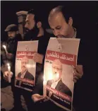  ?? ERDEM SAHIN/EPA-EFE ?? Demonstrat­ors gather for a vigil for slain journalist Jamal Khashoggi last month outside the Saudi Arabian Consulate in Istanbul, where he was killed.