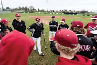  ?? PHOTOS BY DARREN STONE, TIMES COLONIST ?? Victoria Eagles’ new head coach, Charlie Strandlund, talks to his players during practice at Lambrick Park last week.