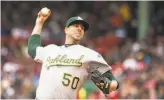  ?? Kathryn Riley / Getty Images ?? A’s starter Mike Fiers allowed three runs in five innings, departing after throwing 64 pitches against Boston.