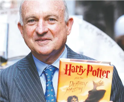  ?? CHIP EAST / BLOOMBERG VIA GETTY IMAGES FILES ?? Richard Robinson, former chief executive of Scholastic Corp., signed the U.S. rights to J. K. Rowling’s smash-hit
Harry Potter books, one of which is pictured, and the popular The Hunger Games series by Suzanne Collins.