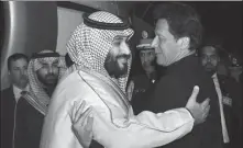  ?? REUTERS ?? Pakistani Prime Minister Imran Khan (right) greets Saudi Arabia’s Crown Prince Mohammed bin Salman Al Saud on his arrival at Pakistan Air Force Nur Khan Base in Pakistan on Sunday.