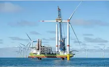  ?? Courtesy of RWE ?? RWE’s Kaskasi Offshore Wind Farm, consisting of 38 turbines with a capacity of 342 megawatts, is under constructi­on off the coast of Germany in the North Sea before it was completed in December 2022.