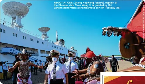  ?? ?? NEGOTIATIO­NS: Zhang Hogwang (centre), captain of the Chinese ship Yuan Wang 5, is greeted by Sri Lankan performers at Hambantota port on Tuesday (16)