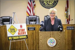  ?? BRUCE R. BENNETT / THE PALM BEACH POST ?? Lake Worth Mayor Pam Triolo announces Monday that the city has become the second municipali­ty in Palm Beach County to have quiet zones at railroad crossings.