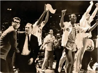  ?? AP 1966 ?? Texas Western coach Don Haskins (second from left) and players celebrate after winning the NCAA basketball championsh­ip in College Park, Maryland, 54 years ago.