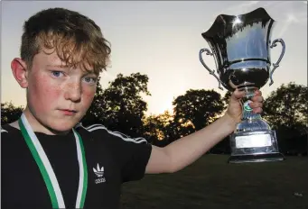  ?? Photo by John Reidy. ?? Agri Specs U-15 team’s James Kenny from Ballymacel­ligott became the first captain to take home the Georgie O’Callaghan Memorial Cup.