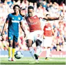  ??  ?? Making it safe: Danny Welbeck scores Arsenal’s third goal at the Emirates