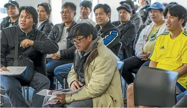  ??  ?? Migrant Filipino constructi­on workers attend a union meeting in Christchur­ch to discuss their pay and conditions.