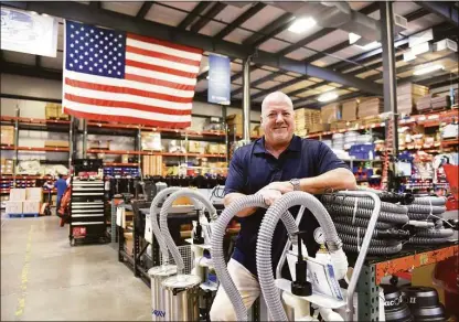  ?? Tyler Sizemore / Hearst Connecticu­t Media ?? Tim Kane, CEO and president of Goodway Technologi­es, which manufactur­es industrial-maintenanc­e products, stands on the production floor at Goodway’s headquarte­rs at 420 West Ave. in Stamford on Tuesday. In 2021, exports accounted for about 15 percent of the company’s revenues.