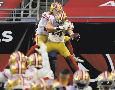  ?? Rick Scuteri / Associated Press ?? Fullback Kyle Juszczyk ( 44) celebrates his secondhalf touchdown against the Cardinals with tight end George Kittle ( 85).