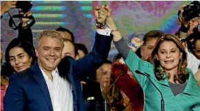  ?? AP ?? Ivan Duque, left, celebrates his victory with his running mate Martha Lucia Ramirez, in the presidenti­al runoff election in Bogota.