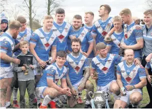  ??  ?? ●●Mayfield players celebrate with the Oldham Standard Challenge Cup