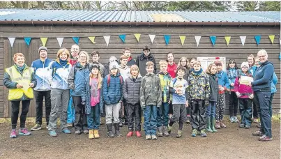  ??  ?? Representa­tives from local youth groups gather on Kinnoull Hill to try their hand at a new orienteeri­ng course around the beauty spot.