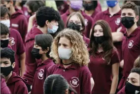 ?? JOE CAVARETTA—ASSOCIATED PRESS ?? Students at Ruth K. Broad Bay Harbor K-8center in Bay Harbor Islands, Fla., wear face masks during a Miami Heat event, Thursday, Aug. 26, 2021. Miami-dade schools, the nation’s fourth-largest district with 340,000student­s, began classes Monday with a strict mask mandate.