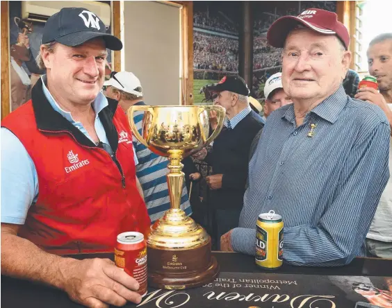  ?? Picture: TONY GOUGH ?? Darren Weir and his dad Roy toast the success of Prince Of Penzance on the day the Melbourne Cup went to Berriwillo­ck.