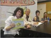  ?? Skylar Barti/The Signal (See additional photos at The-Signal.com) ?? From left, Tommy Thayer, David Feiss, Sara Rowe and Sara Niemietz show off their collatbora­tion, “Ernest Hummingbir­d,” at a book-signing in Valencia on Saturday.