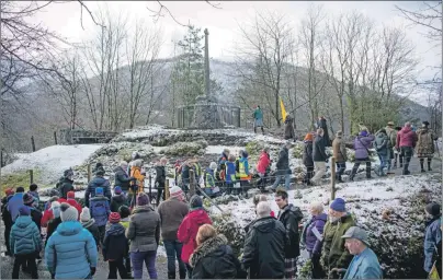  ??  ?? The procession makes its way to the massacre memorial at Glencoe last week.