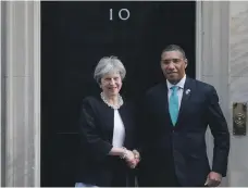  ?? AFP ?? British Prime Minister Theresa May and Jamaican counterpar­t Andrew Holmes at 10 Downing Street before a gathering of the Commonweal­th heads of government