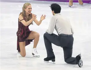  ?? STEVE RUSSELL TORONTO STAR FILE PHOTO ?? Kaitlyn Weaver and Andrew Poje of Canada celebrate after their skate in the ice dance free program at the PyeongChan­g 2018 Winter Olympics. Their friend Denis Ten was killed in July.