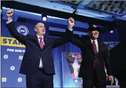  ?? ALEX BRANDON — THE ASSOCIATED PRESS ?? President Joe Biden stands with Shawn Fain, president of the United Auto Workers, at the United Auto Workers' political convention Wednesday in Washington.