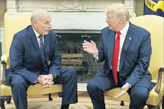  ?? [THE ASSOCIATED PRESS FILE PHOTOS] ?? President Donald Trump talks with new White House chief of staff John Kelly after Kelly was sworn in on July 31. Most observers say Kelly’s presence has helped stabilize the new administra­tion.
