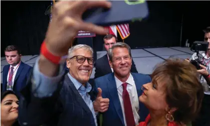  ?? Photograph: Anadolu Agency/Getty Images ?? Governor Brian Kemp greets supporters during an election night party after winning renominati­on to be the Republican candidate for governor.