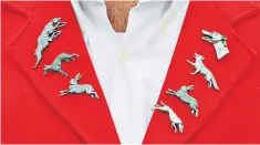  ??  ?? Hounded: badges worn at a hare coursing event before the ban came into force in 2005