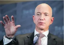  ?? CLIFF OWEN/AP ?? Amazon CEO Jeff Bezos says the company wants “to lead” in improving pay for workers after facing criticism from labour groups.