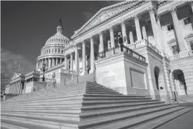  ?? Associated Press ?? The U.S. Senate is seen June 27 on Capitol Hill in Washington. July shapes up as one of the most critical tests for President Donald Trump’s agenda in Congress. Get health care done in the Senate, a budget in the House and overhaul of the nation’s tax...