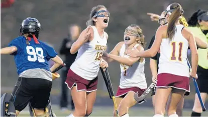  ?? STEVE RUARK/FOR THE BALTIMORE SUN MEDIA GROUP ?? Hereford’s Mackenzie McKillop (16), Peyton Martino and Kailyn Brandt celebrate after McKillop scored the second of her three goals. McKillop’s hat trick gave her 10 goals for the season. All of her goals Monday came in the second half, including two in...